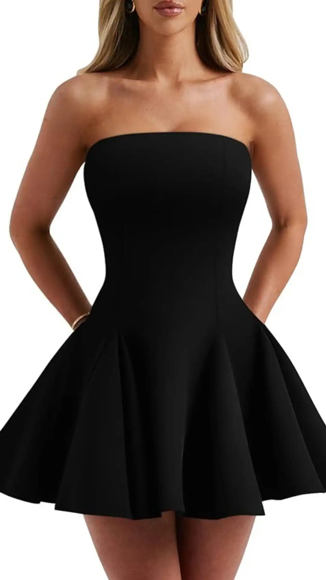 This strapless black homecoming dress showcases a fitted bodice flowing into a flared skirt made from a smooth, stretch fabric that offers comfort and movement. The sleek, minimalist design exudes a classic and chic vibe, making it perfect for formal events, parties, or school dances, aimed at teenage girls.