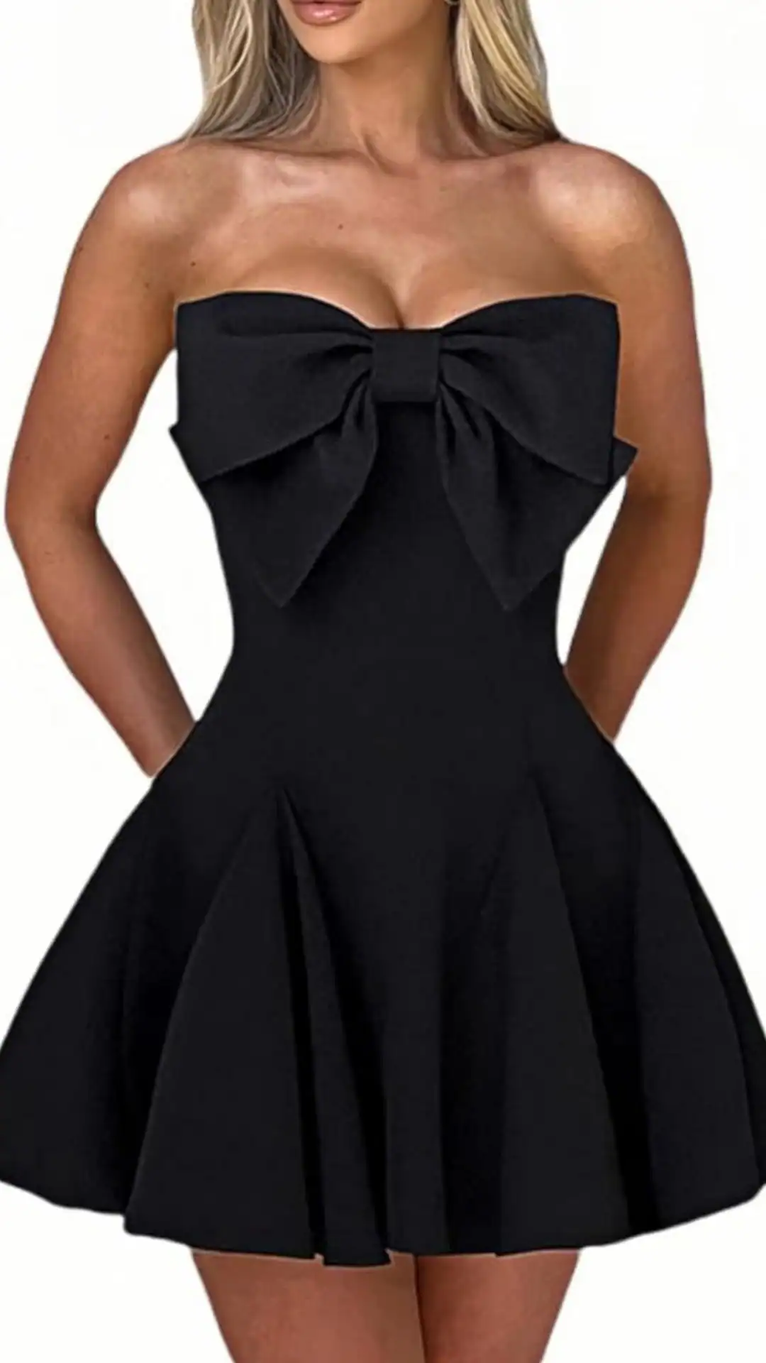 This strapless black homecoming dress features a fitted bodice and a playful, flared skirt, adorned with a large statement bow at the chest for a chic touch. Crafted from a smooth, lightweight fabric that offers a flattering silhouette, the dress combines a youthful vibe with a classic elegance, making it a perfect choice for teen formal events or school dances.