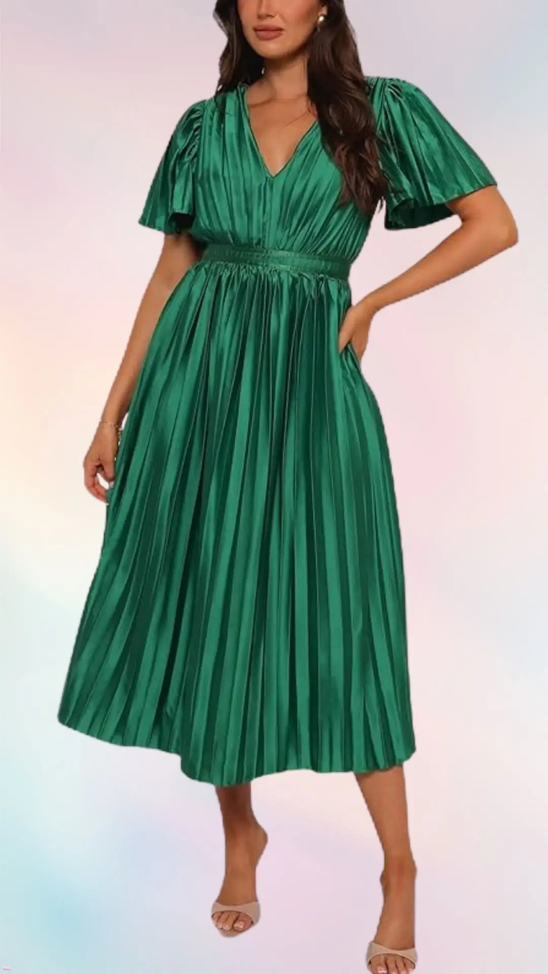 A vibrant green pleated dress features short puff sleeves and a deep V-neckline, cinched at the waist for a flattering fit. The flowing skirt falls to mid-calf, creating an elegant silhouette perfect for summer occasions. Paired with light-colored heeled sandals, the outfit radiates a fresh and stylish look.