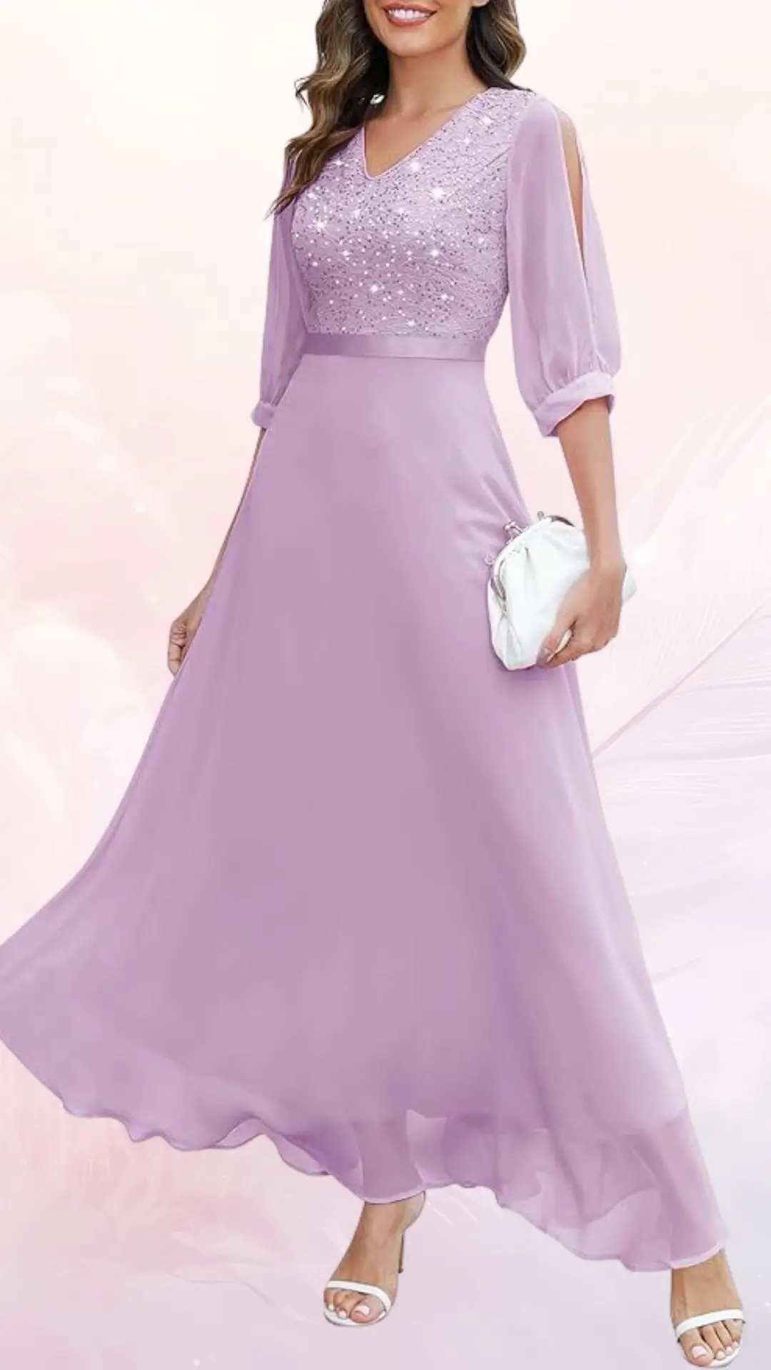 A lightweight, flowy lavender wedding guest dress features a fitted bodice adorned with sparkling embellishments and elegant three-quarter sheer puff sleeves. The skirt flows gracefully, enhancing the dress's ethereal appearance, complemented by matching strappy heels and a small white clutch. The overall look is perfect for a summer wedding.