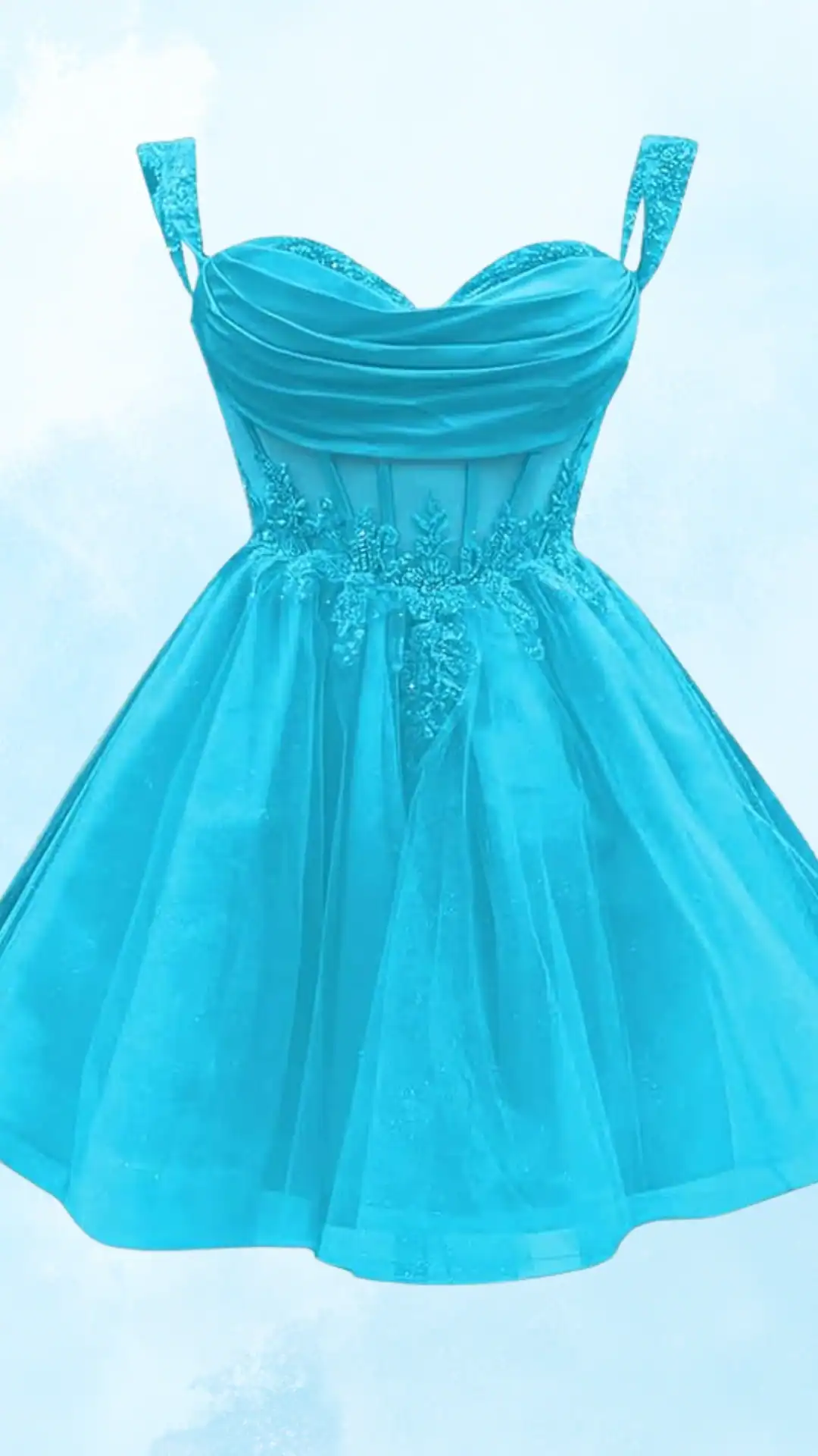 This vibrant turquoise homecoming dress features a fitted bodice with ruching, delicate embellished straps, and a flared skirt made from lightweight tulle that adds volume and movement. The overall design exudes a playful and youthful charm, making it perfect for a festive school dance or special occasion.
