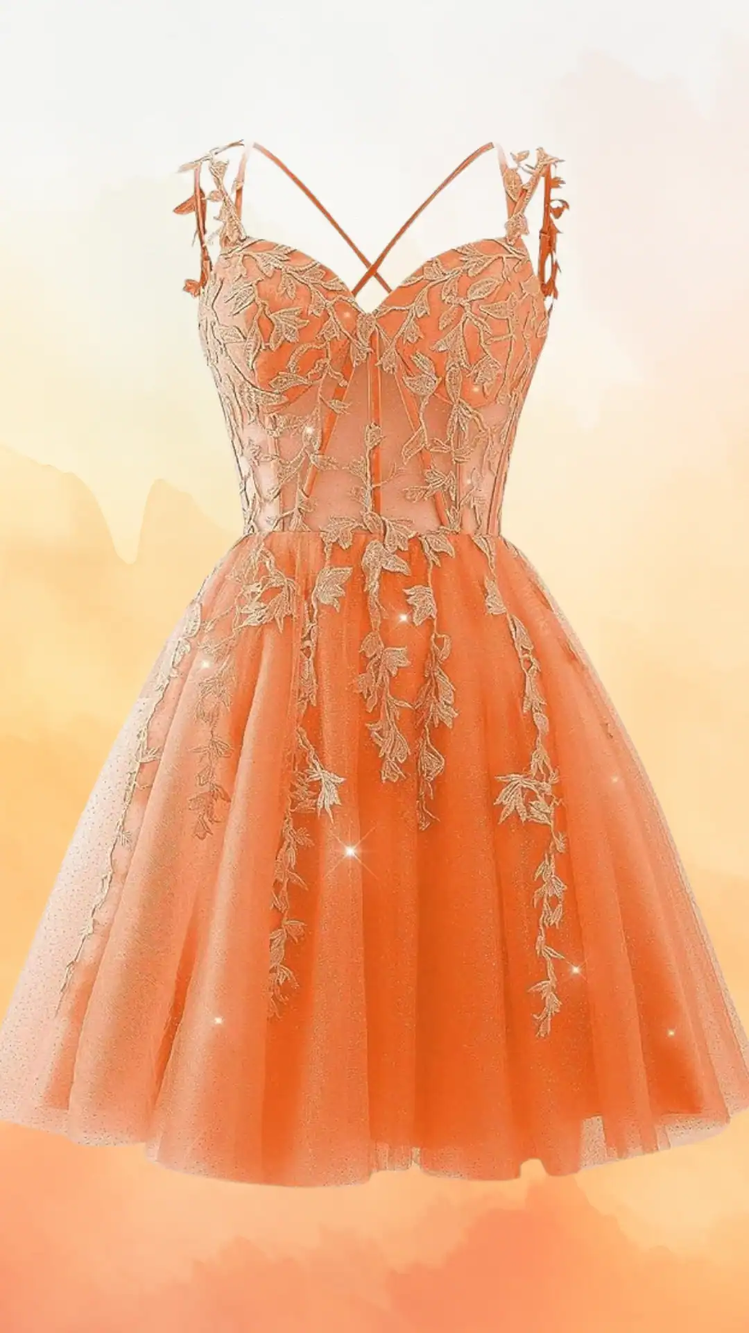 This vibrant orange homecoming dress features a fitted bodice embellished with intricate gold floral embroidery and delicate lace trim, transitioning into a playful, voluminous tulle skirt. The crisscross spaghetti straps enhance the flirty and youthful vibe, making it perfect for teenage girls attending a formal school dance or special occasion.