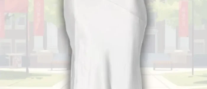 white-graduation-dress-with-deep-v-neck-2025-12-14T01:17:07.000Z A sleek white graduation dress features a deep V-neckline and elegant cowl detailing at the front. The dress flows down to a fitted silhouette, accentuating the figure, with a soft sheen that reflects light. It is paired with delicate strappy sandals, enhancing the overall sophisticated look.