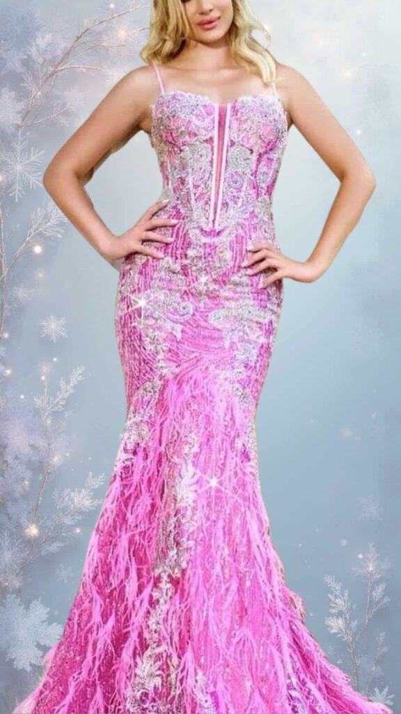 This elegant winter formal dress features a fitted silhouette with a sweetheart neckline and delicate spaghetti straps, creating a chic and feminine look. Made of vibrant pink fabric adorned with intricate beadwork and shimmering textures, the gown is complemented by flowing fringe details that add movement.