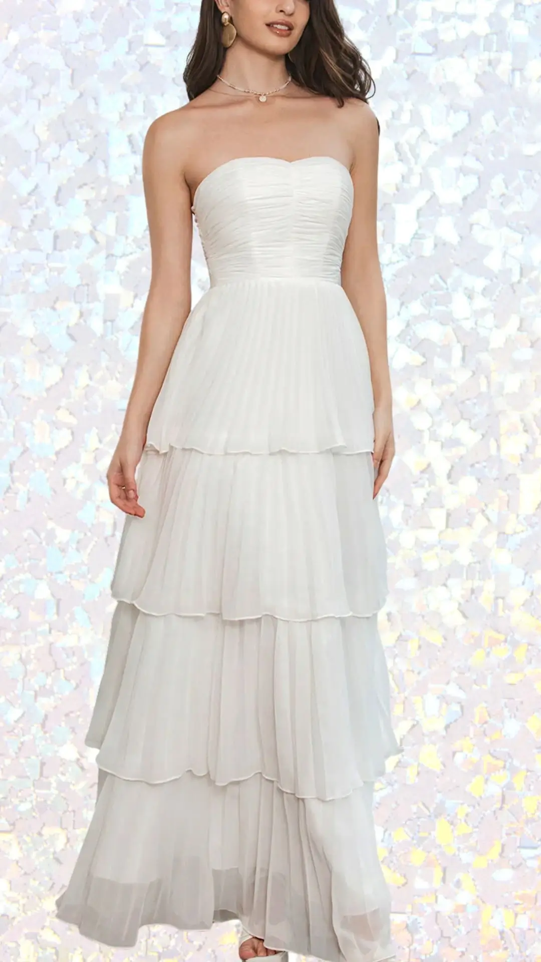 This elegant long white winter formal dress features a strapless sweetheart neckline and a tiered design with soft, flowing pleats. Made from lightweight fabric, it creates a graceful silhouette and enhances movement, while the delicate layered hems add a touch of sophistication. The smooth texture and subtle sheen make it an ideal choice for a winter formal event.