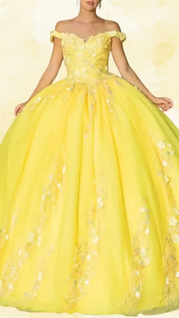 The dress features a vibrant, sunny yellow hue with an off-the-shoulder neckline and short sleeves adorned with floral embellishments. Its voluminous ball gown silhouette extends to a floor-length hemline, accented by intricate floral appliqués and shimmering sequins that cascade down the bodice and skirt. The combination of the bright yellow fabric and shimmering details creates an eye-catching, celebratory look perfect for a Quinceañera.