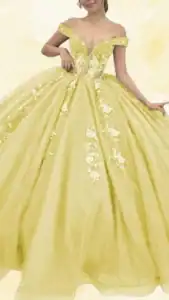 The dress features a vibrant yellow color with a shimmering finish and an off-the-shoulder neckline that enhances its elegance. It has a fitted bodice adorned with intricate floral appliqués that extend down to the voluminous, floor-length skirt, creating a dramatic and festive silhouette. The design combines soft pastel yellow hues with sparkling details, making it a standout choice for a Quinceanera celebration.